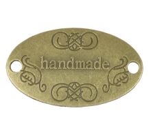 Nášivka Hand Made kovová bronzová 32x19 mm Nášivka Hand Made kovová bronzová 32x19 mm